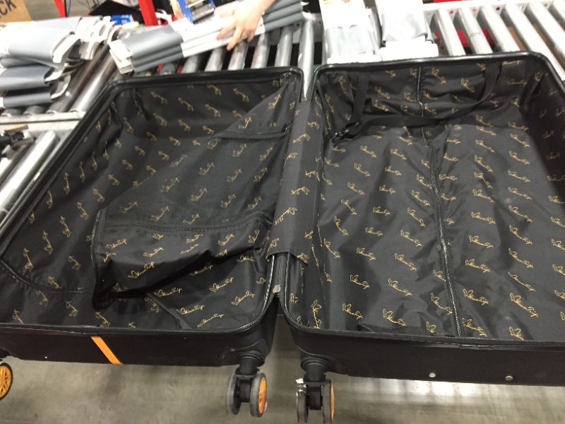 Photo 2 of 2 black and gold  suit cases 1 carry on and 1 big suit case 