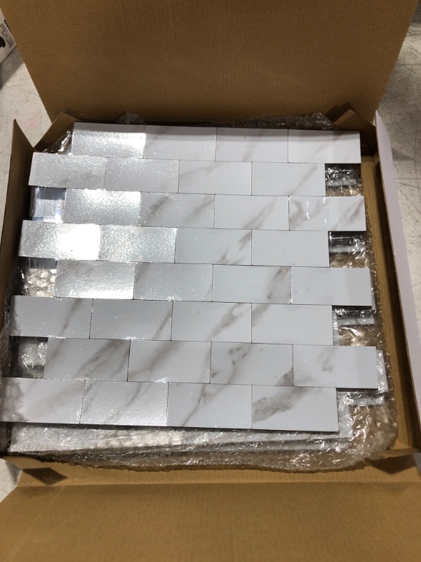 Photo 2 of Yipscazo Peel and Stick Metal Tile Backsplash Wall Tile, PVC Kitchen Backsplash, Stick on Tiles for Backsplash Kitchen, Bathroom (12'' X 12'', Sample in Marble White)
