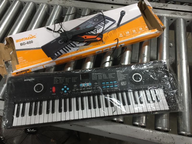 Photo 2 of BDMusic Electric Keyboard. Batteries not included