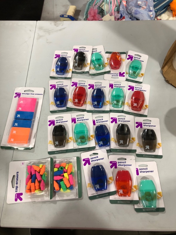 Photo 1 of Various school supplies Pencil sharpeners and Erasers.