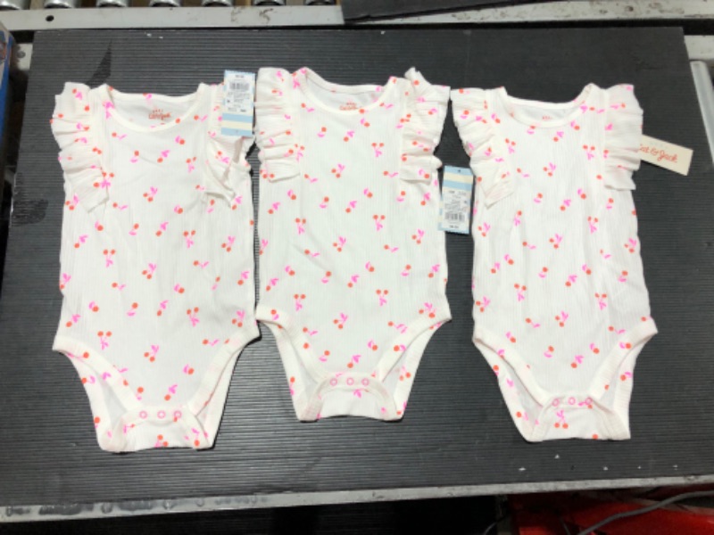 Photo 2 of Baby Girls' Cherry Rib Ruffle Bodysuit - Cat & Jack™ White (Size: 18M) Pack of 3