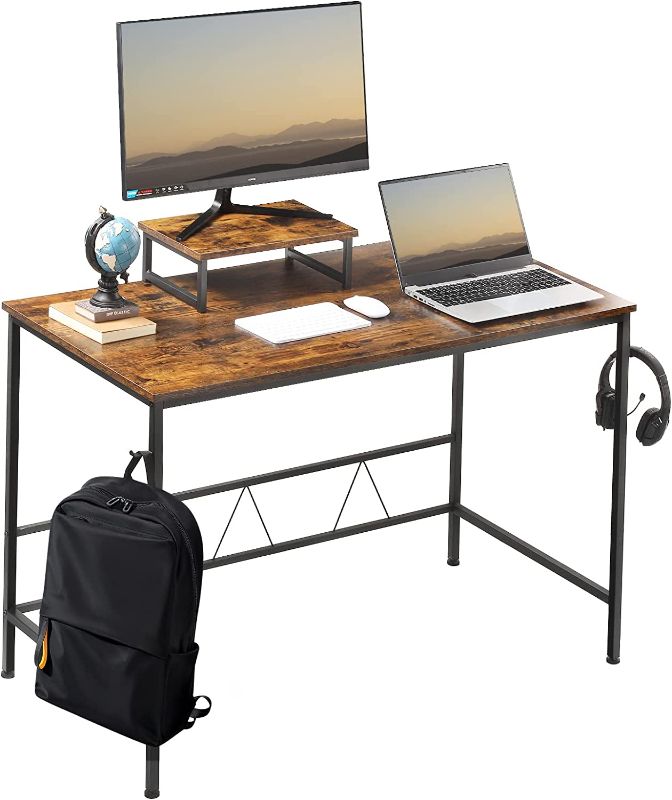 Photo 1 of Computer Writing Desk 47 inch, Home Office Desk with Monitor Stand and Iron Hook,Laptop Desk for Living, Bedroom, Easy to Assemble(Rustic Brown)