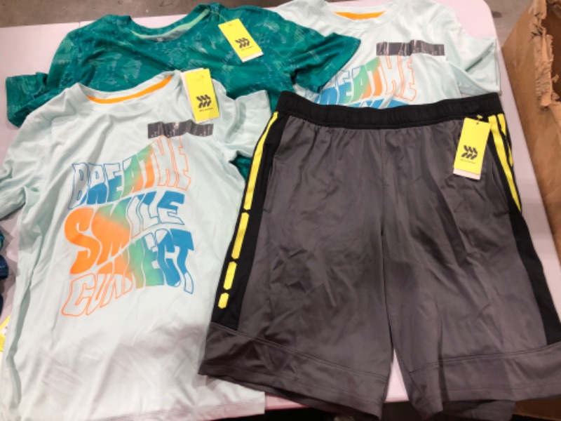 Photo 1 of Assorted Running Clothes (Sizes Vary)