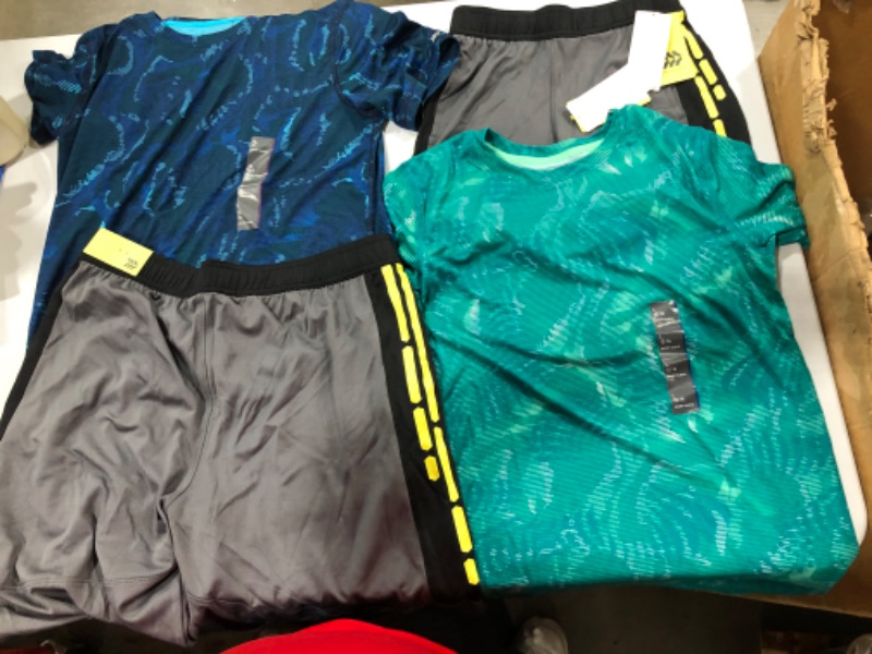 Photo 1 of Assorted Running Clothes (Sizes Vary)