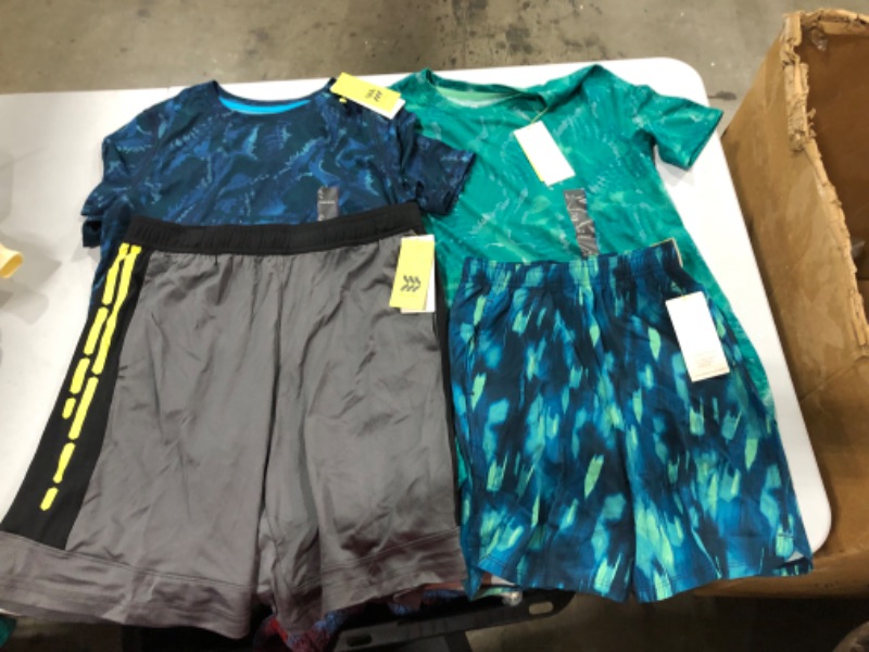 Photo 1 of Assorted Running Clothes (Sizes Vary)