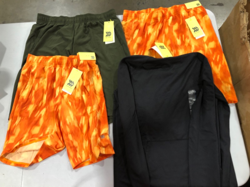 Photo 1 of Assorted Running Clothes (Sizes Vary)