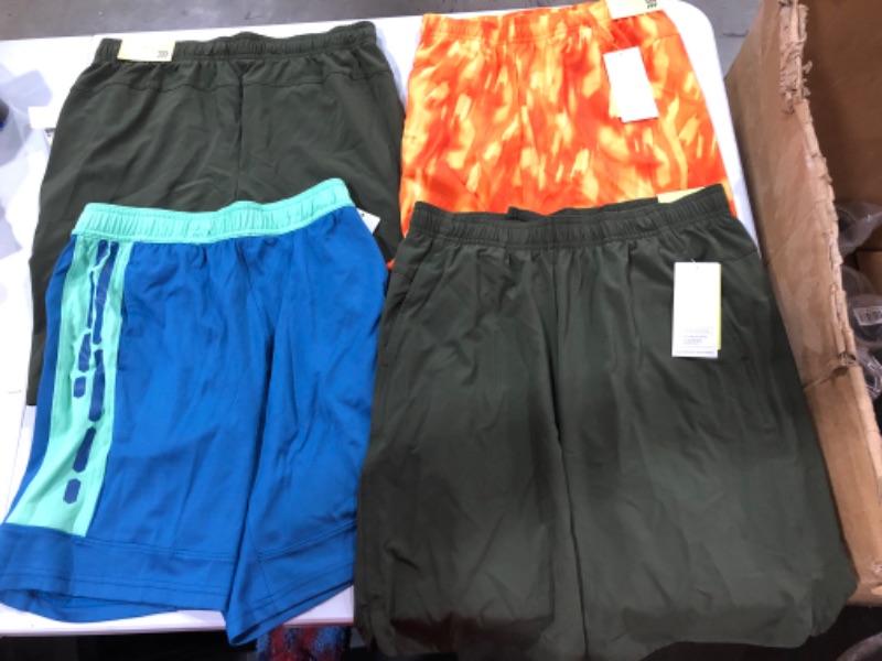 Photo 1 of Assorted Running Clothes (Sizes Vary)