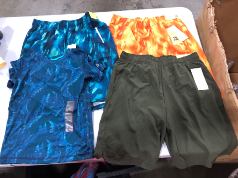 Photo 1 of Assorted Running Clothes (Sizes Vary)