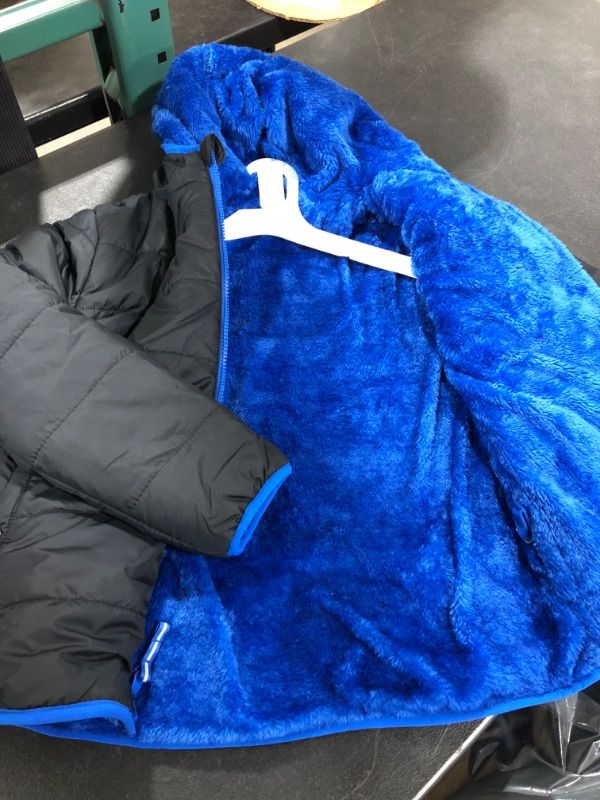 Photo 2 of  Black/Blue  Reversible Puffer Jacket from Cat and Jack™. Made from a water- and wind-resistant fabric, this boys' hooded puffer jacket ensures he stays nice and warm in chilly weather.   SIZE MEDIUM BOYS 