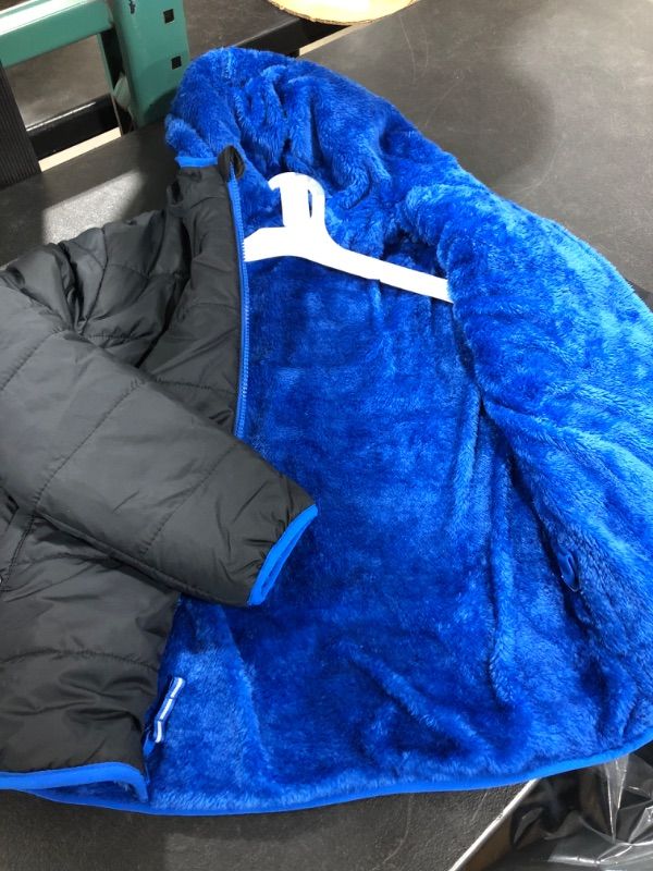 Photo 3 of  Black/Blue  Reversible Puffer Jacket from Cat and Jack™. Made from a water- and wind-resistant fabric, this boys' hooded puffer jacket ensures he stays nice and warm in chilly weather.   SIZE MEDIUM BOYS 