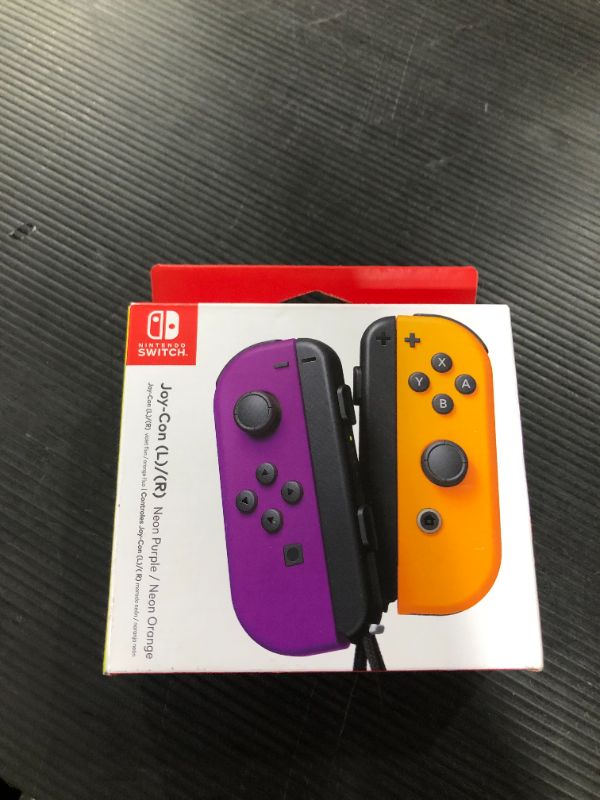 Photo 1 of Nintendo Neon Purple/ Neon Orange Joy-Con (L-R) - Switch
