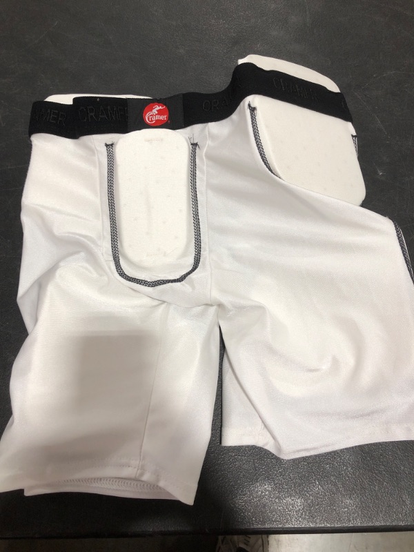 Photo 2 of KRAMER PADDED PROTECTIVE SHORTS, WHITE, SIZE YOUTH XL. PRIOR USE. MISSING PACKAGE.