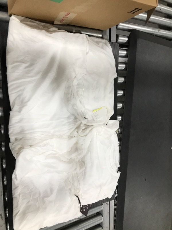 Photo 1 of A box lot of plain whiter t shirts. SIZES VARY THROUGH BOX. FOUR COUNT. 