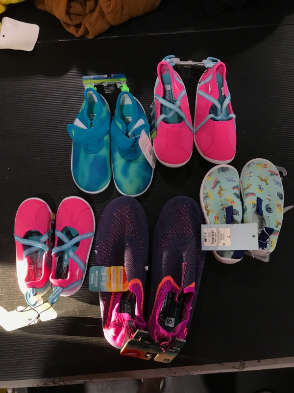 Photo 1 of A box lot of miscellaneous children's water shoes. SIZES vary throughout bag. 