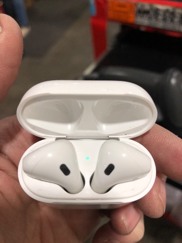 Photo 2 of Apple AirPods with Charging Case (Latest Model)