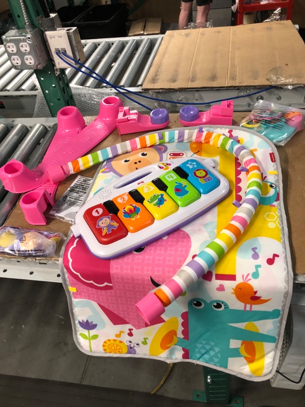 Photo 3 of **USED BUT APPEARS NEW**  Fisher-Price Deluxe Kick & Play Piano Gym, Pink, Baby Activity Playmat With Toy Piano, Lights, Music And Smart Stages Learning Content Pink Kick 'n Play Piano - Frustration Free Packaging