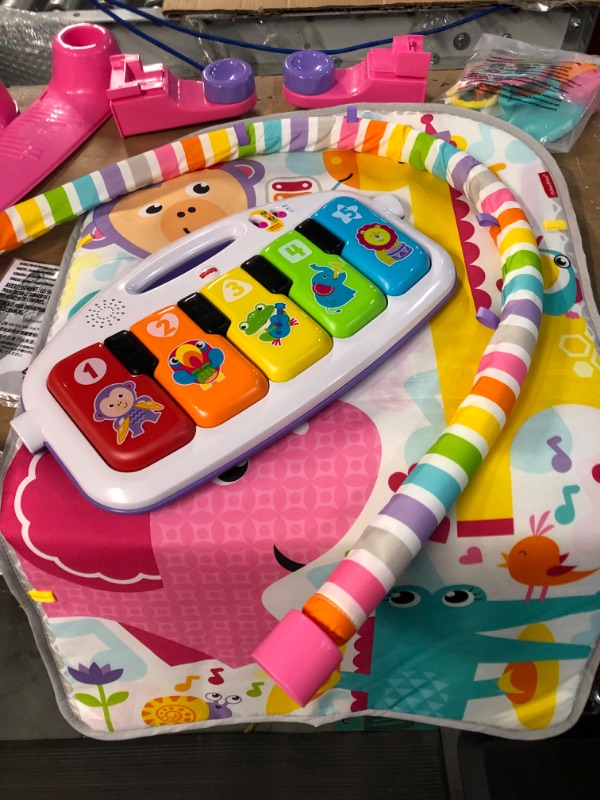 Photo 4 of **USED BUT APPEARS NEW**  Fisher-Price Deluxe Kick & Play Piano Gym, Pink, Baby Activity Playmat With Toy Piano, Lights, Music And Smart Stages Learning Content Pink Kick 'n Play Piano - Frustration Free Packaging