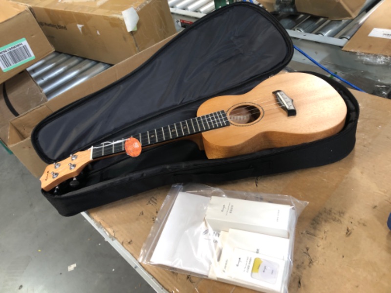 Photo 2 of **USED BUT APPEARS NEW**  Enya Concert Ukulele 23 Inch Solid Mahogany Top Ukelele for Beginner with Gig bag, Capo, Strap, Strings, Pick (EUC-25D Nature)