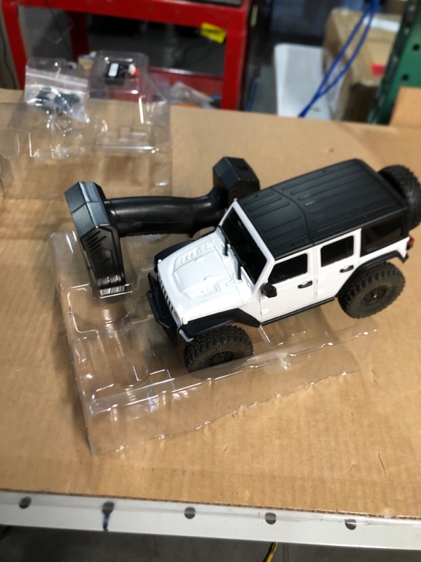 Photo 2 of * USED * 
RACENT Rock Crawler RC Truck 4x4 Off Road Crawler Climbing Vehicle All Terrain RC Monster Truck Remote Control Car with Bright Headlight 2 Batteries Waterproof Hobby Toys for Kids (787-1 White)