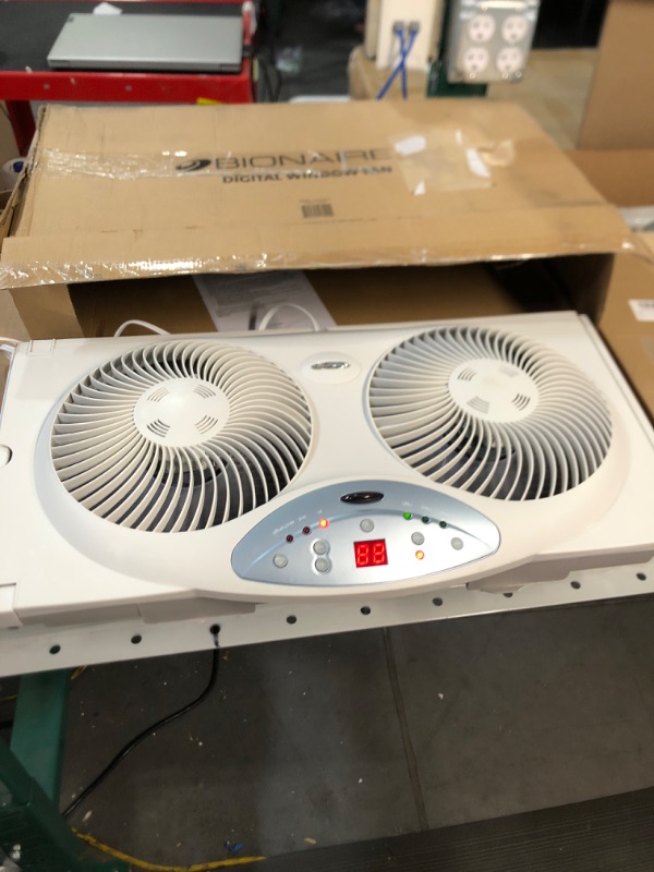 Photo 2 of *DAMAGED*
Bionaire Window Fan with Twin 8.5-Inch Reversible Airflow Blades and Remote Control, White White 2 Blades Electronic control with LCD screen Window Fan