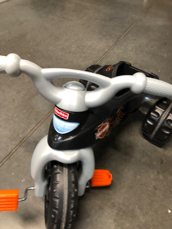 Photo 5 of Fisher-Price Harley-Davidson Tricycle with Handlebar Grips and Storage Area, Multi-Terrain Tires, Tough Trike [Amazon Exclusive] Harley - Davidson