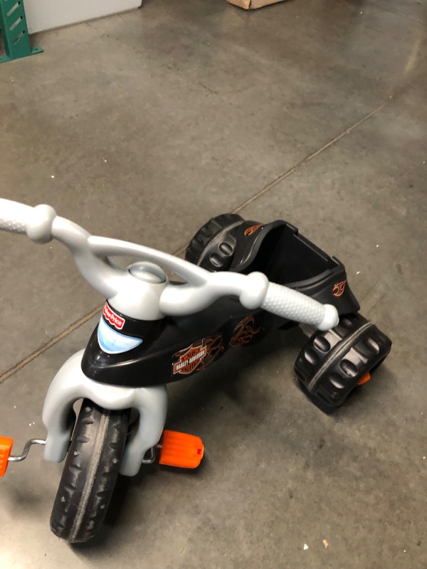 Photo 4 of Fisher-Price Harley-Davidson Tricycle with Handlebar Grips and Storage Area, Multi-Terrain Tires, Tough Trike [Amazon Exclusive] Harley - Davidson