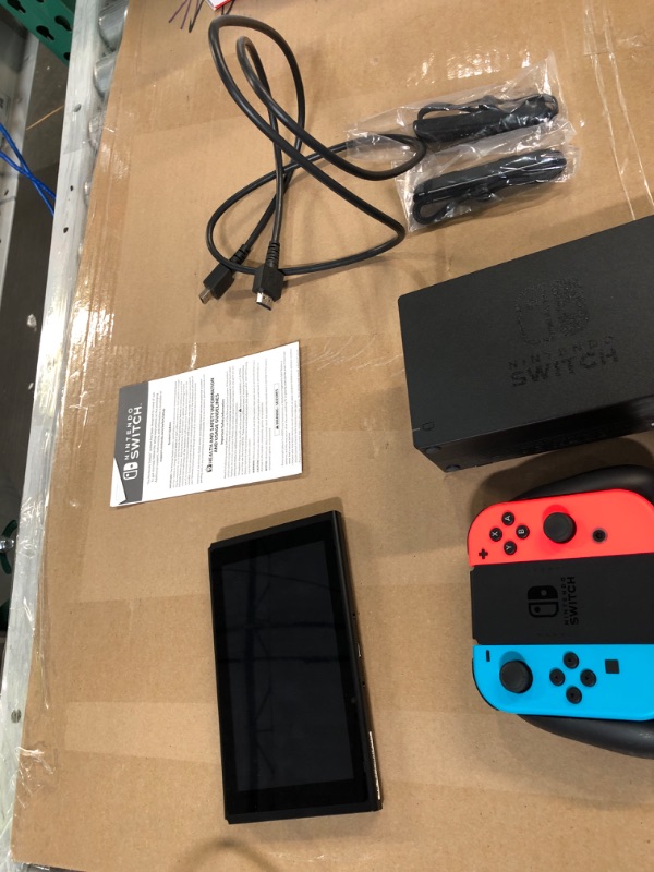 Photo 2 of Nintendo Switch Console with Neon Blue & Red Joy-Con.