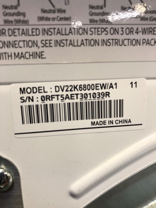 Photo 3 of 24 Inch Electric Dryer with 4.0 cu. ft. Capacity, Sensor Dry, Smart Care, Reversible Door, Stainless Steel Drum, 4-Way Venting, Internal Drum Light, Filter Check Indicator, 12 Dryer Programs, Quick Dry, Wrinkle Release, and Child Lock
   ----there is some