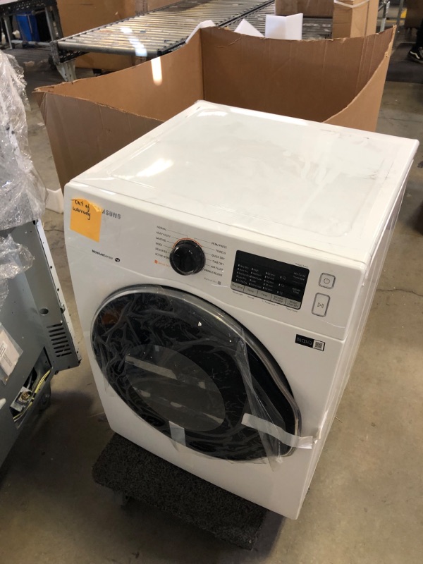 Photo 4 of 24 Inch Electric Dryer with 4.0 cu. ft. Capacity, Sensor Dry, Smart Care, Reversible Door, Stainless Steel Drum, 4-Way Venting, Internal Drum Light, Filter Check Indicator, 12 Dryer Programs, Quick Dry, Wrinkle Release, and Child Lock
   ----there is some