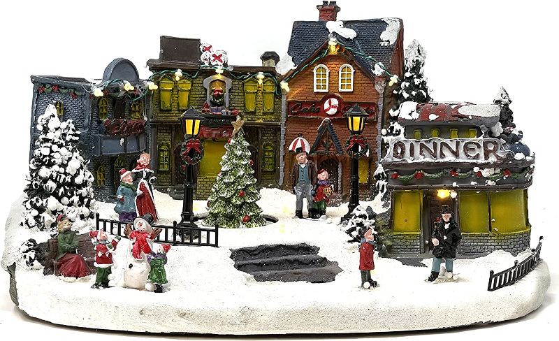 Photo 1 of Allgala Crafted Polyresin Christmas House Collectable Figurine with USB and Battery Dual Power Source-Dinner and Tree in Village - ONE OF THE CHARACTERS IS BROKEN OFF -