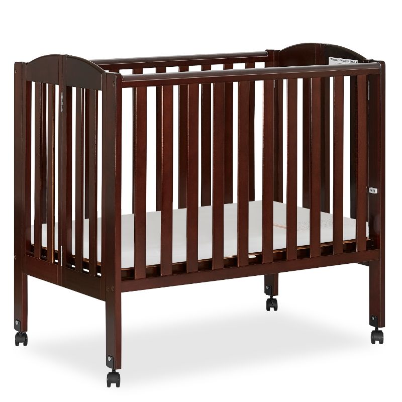 Photo 1 of Dream On Me 2-in-1 Folding Portable Mini Crib, Natural - no hardware, wood may be damaged 