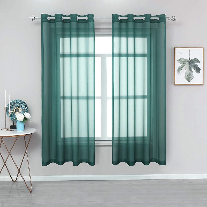 Photo 1 of YGO Sheer Teal Curtains 63 Inches Long for Bedroom - Ring Top Sheer Voile Gauzy Light Filtering Curtains Drapes for Living Room, 2 Panels, Teal Green, 54 Inch x 63 Inch