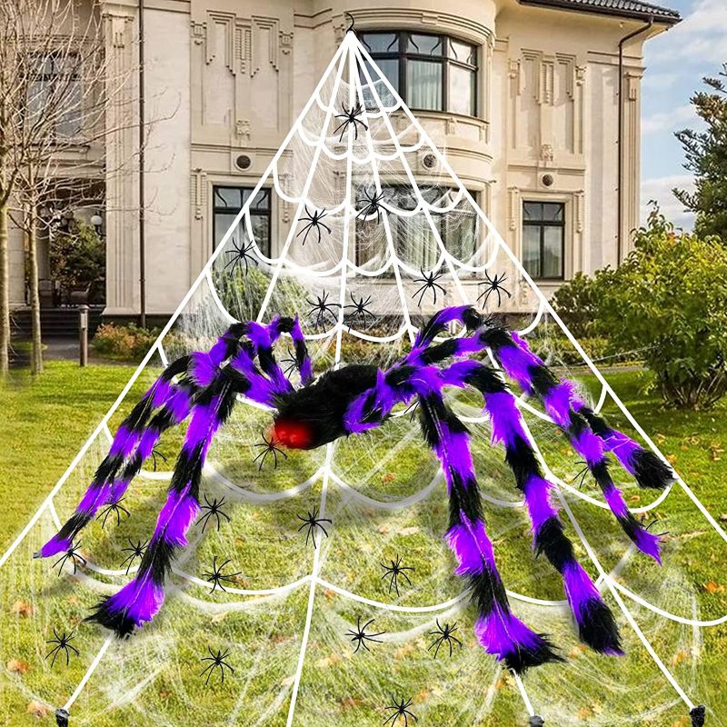 Photo 1 of 17 Ft Giant Spider Web Halloween Decorations Outdoor with 50" Large Purple Spider, Stretch Cobweb,10 Glow in The Dark Spiders 10 Fake Spiders Halloween Indoor Outside Creepy Decor Yard Lawn Garden
