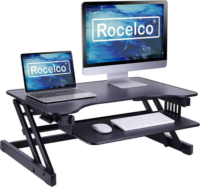 Photo 1 of Rocelco 32" Height Adjustable Standing Desk Converter - Quick Sit Stand Up Dual Monitor Riser - Gas Spring Assist Tabletop Computer Workstation - Large Retractable Keyboard Tray - Black (R ADRB)
