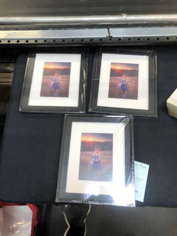 Photo 1 of 3 PK 10"x12" picture frames (packagning states 4, missing 1). 