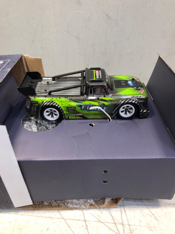 Photo 2 of 1/28 RC Drift Car,WLTOYS 284131 with /Two Battery/30KM/H High Speed/LED Car Lamp/130 Brushed Motor/2.4GHz Control/4WD System/DIY Upgradable,RC Sport Racing Car for Adults and Boys Gifts (RTR) 2 batteries