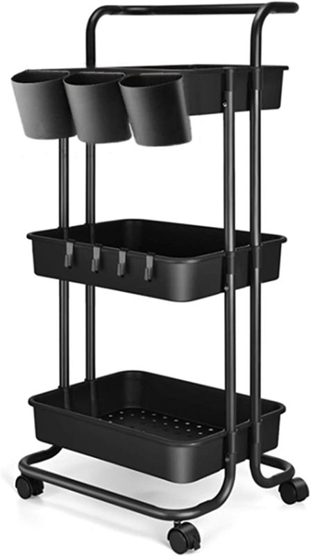 Photo 1 of 3 Tier Utility Rolling Cart - Organizer Cart Storage Cart Kitchen Cart Makeup Cart 3 Shelf Baby Tray Cart with Hanging Cups Trolley Handles and Wheels Use for Bathroom Kids Room Bedroom Office (Black)
