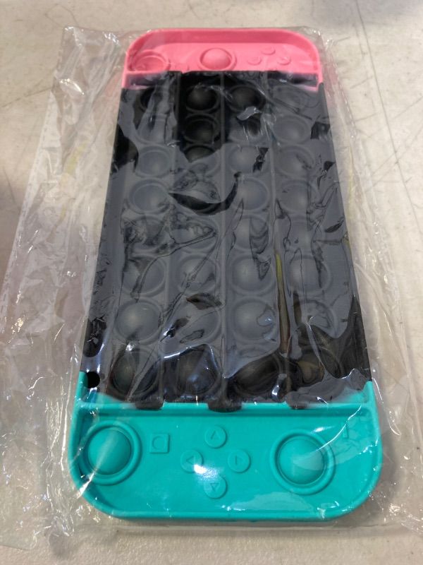 Photo 1 of Push Pop Game Controller Pop Fidget Toy, Stress Relief Gamepad Pop for Boys, Fidget Popper for ADHD and Anxiety, Pop Fidget Toys Gift for Boys and Girls (pikn Black Green)