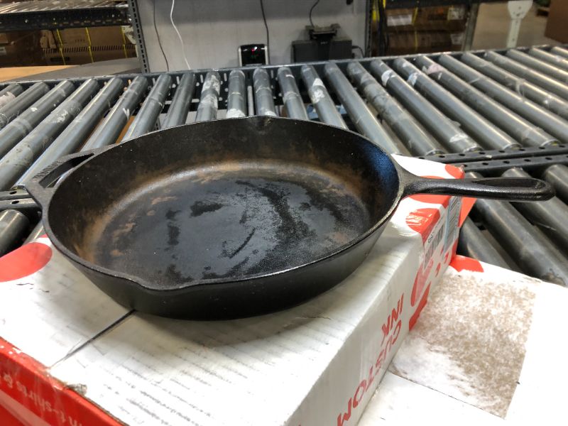 Photo 1 of Lodge L8SK3 10-1/4-Inch Pre-Seasoned Skillet  *** ITEM HAS SOME MARKING AND STAINS FROM PRIOR USE ***
