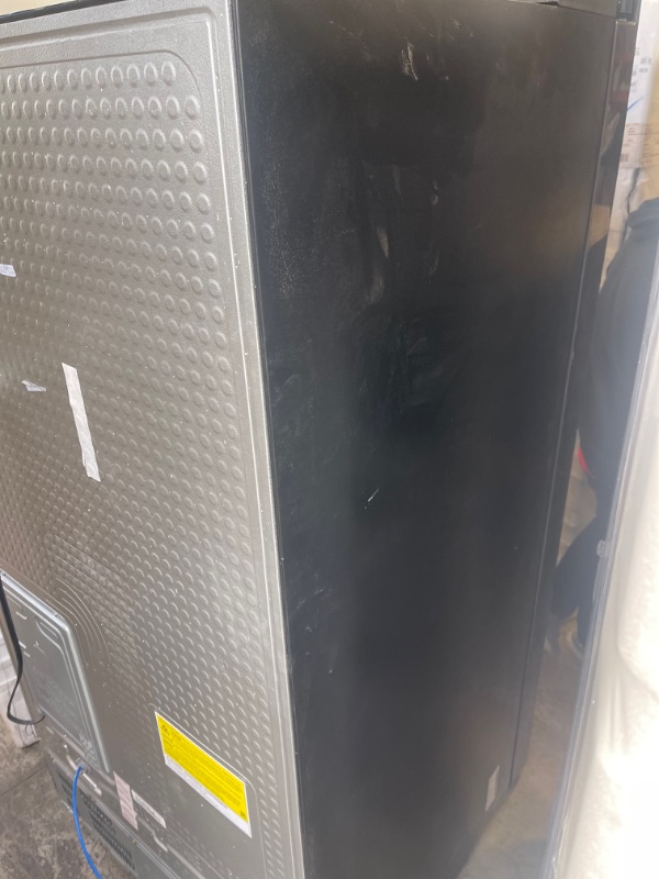 Photo 5 of Samsung - 27.4 Cu. Ft. Side-by-Side Refrigerator - Black stainless steel, INTERIOR VERY CLEAN, EXTERIOR DIRTY/SCUFFED FORM NOT BEING PACAKGED. 
