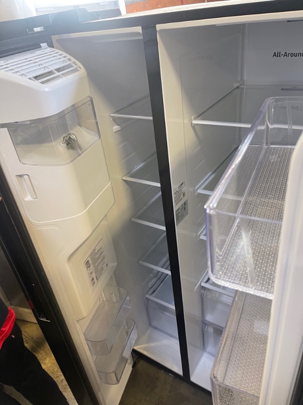 Photo 3 of Samsung - 27.4 Cu. Ft. Side-by-Side Refrigerator - Black stainless steel, INTERIOR VERY CLEAN, EXTERIOR DIRTY/SCUFFED FORM NOT BEING PACAKGED. 
