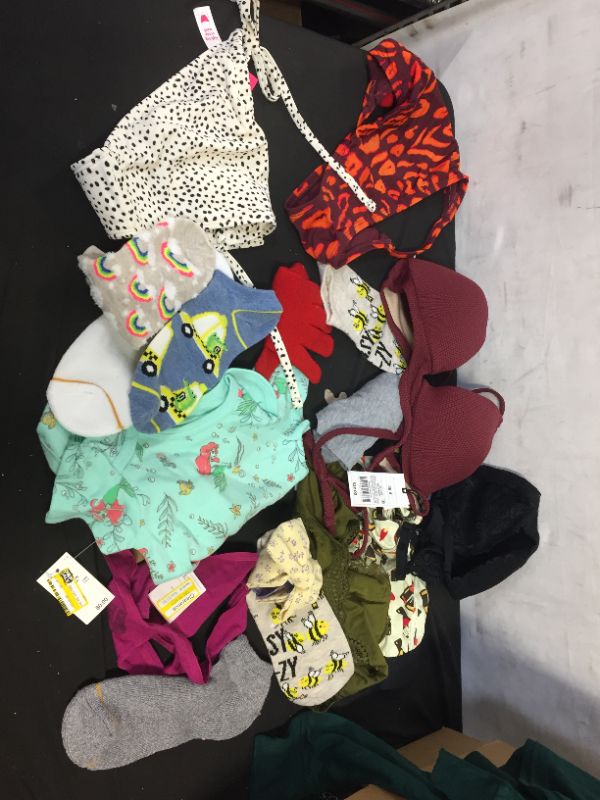 Photo 1 of BUNDLE OF SOCKS AND CLOTHES SIZES VARY LARGE TO SMALL AND  KIDS 