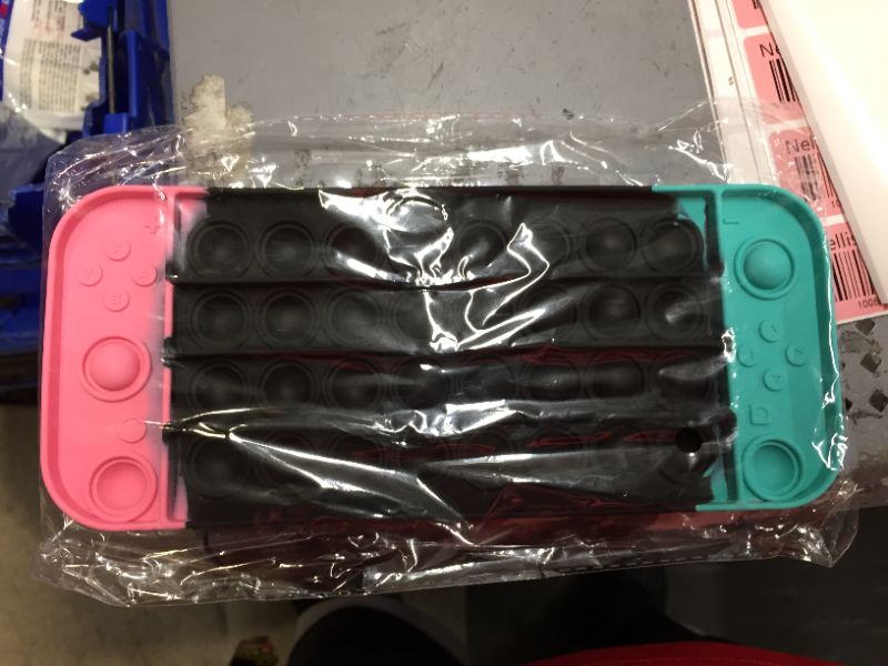 Photo 1 of JAEZZIY Push Pop Game Controller Pop Fidget Toy, Stress Relief Gamepad Pop for Boys, Fidget Popper for ADHD and Anxiety, Pop Fidget Toys Gift for Boys and Girls (pikn Black Green)
