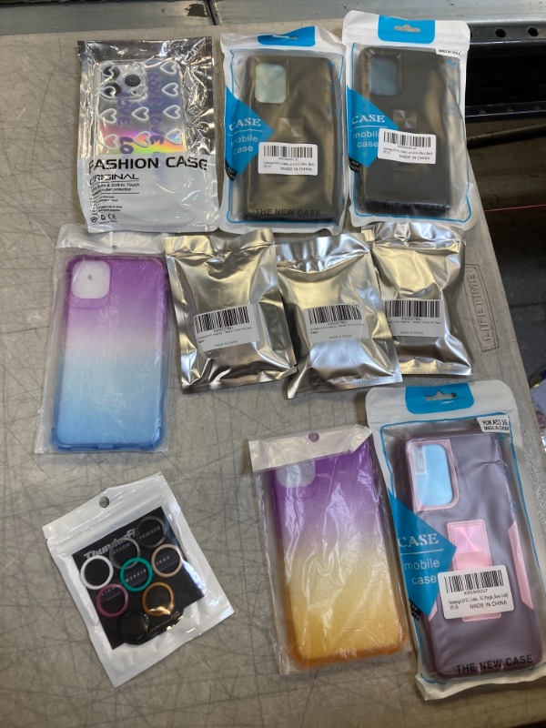 Photo 1 of 10 MISC. PHONE CASES, APPLE WATCH CASES , AND SILICONE RINGS.