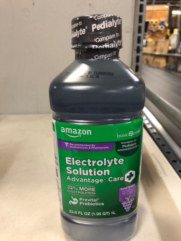 Photo 2 of AMAZON BASIC CARE ADVANTAGE CARE PLUS ELECTROLYTE SOLUTION, ICED GRAPE, HELPS PREVENT DEHYDRATION, FLUIDS, ZINC AND ELECTROLYTES, 1 LITER----exp date --01-2023