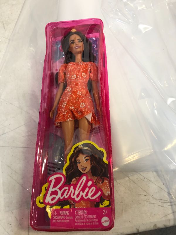 Photo 2 of Barbie Fashionistas Doll, Long Wavy Brunette Hair, Headband, Orange Floral Print Dress with Ruffle Details & Heels, Toy for Kids 3 to 8 Years Old
