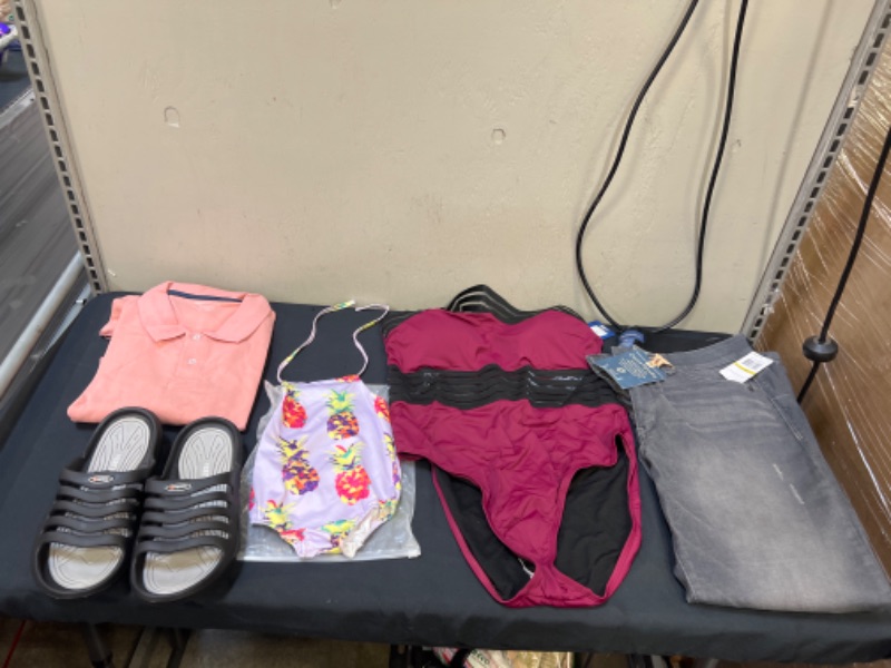 Photo 1 of 5PC LOT, VARIOUS CLOTHES ITEMS, SIZES XXL MENS POLO, 10.5 MENS Sandals, SIZE 14  WOMEN'S IN SWIMSUIT AND GREY PANTS, SIZE 12 MOS IN BABY SWIMSUIT 