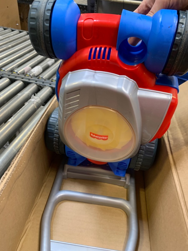 Photo 4 of Fisher-Price Bubble Mower, outdoor push-along toy lawnmower for toddlers and preschool kids, Box Packaging Damaged, Minor Use, Minor Scratches and Scuffs on Plastic, No Bubbles

