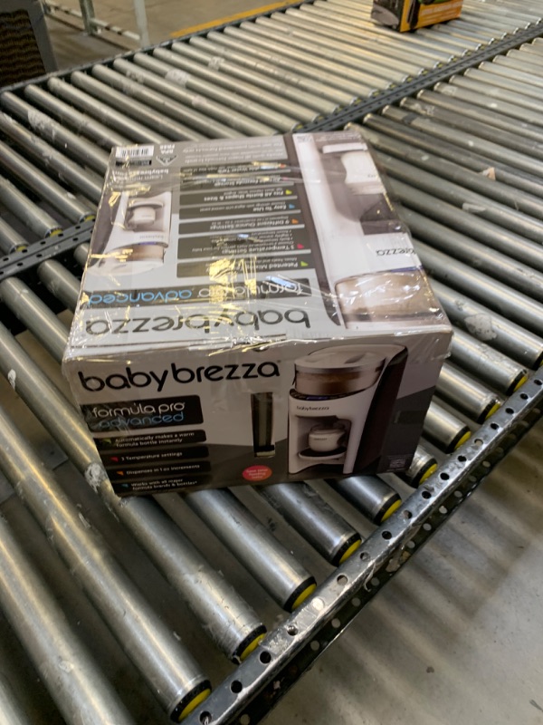 Photo 2 of Baby Brezza New and Improved Formula Pro Advanced Dispenser Machine, Box Packaging Damaged, Minor Use, Minor Scratches and Scuffs on Plastic, Dirty From Previous Use, Water Stains found as shown in pictures