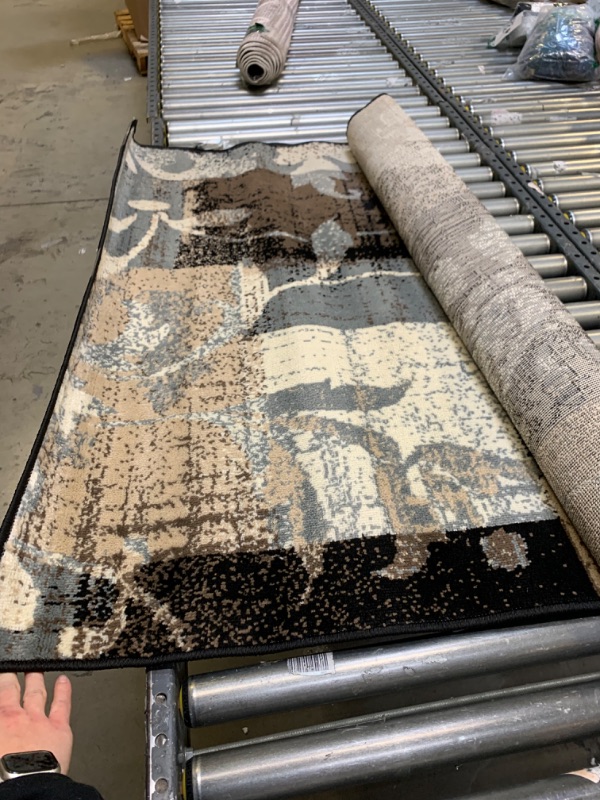 Photo 1 of 4'x6', Black Patterned Rug, No Box Packaging, Minor Use, Minor Fraying on Edges, Creases and Wrinkles in Rug, Dirty From Shipping and Handling, Tape on Rug
